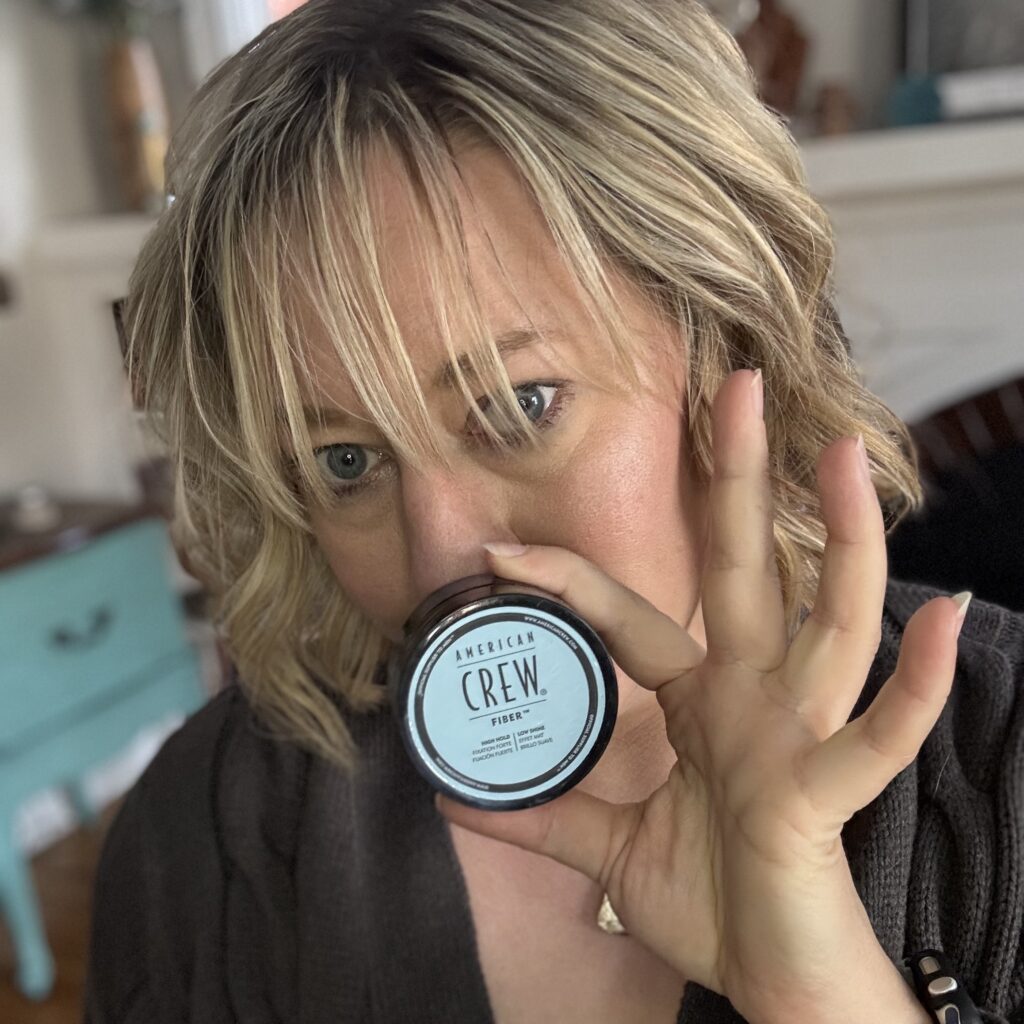 Ginny shows off the tiny size of the American Crew Hair Fiber in front of her delightfully defined curls.