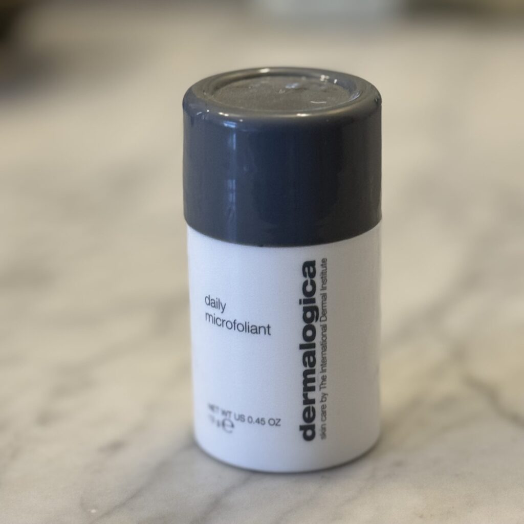Dermalogica Daily Exfoliant powder bottle – lightweight travel cleanser that activates with water to buff skin smooth.