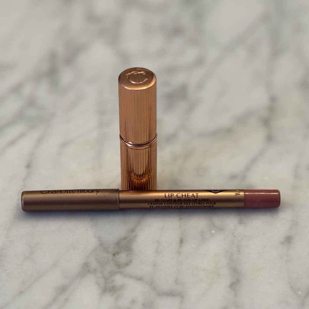 Charlotte Tilbury Pillow Talk mini lipstick, creates a natural, polished lip look.