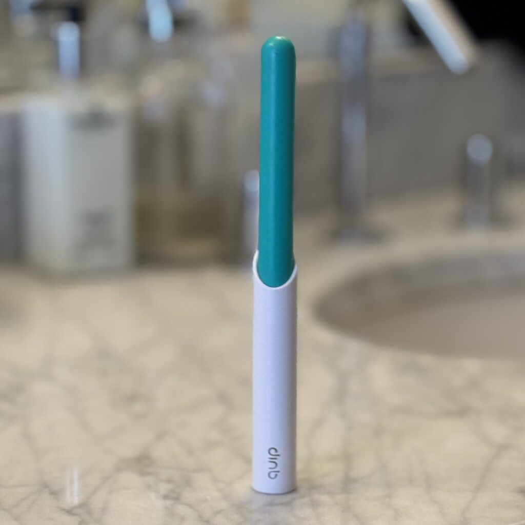 Quip portable electric toothbrush in travel case — slim, lightweight toothbrush with oscillating head and refill subscription service.