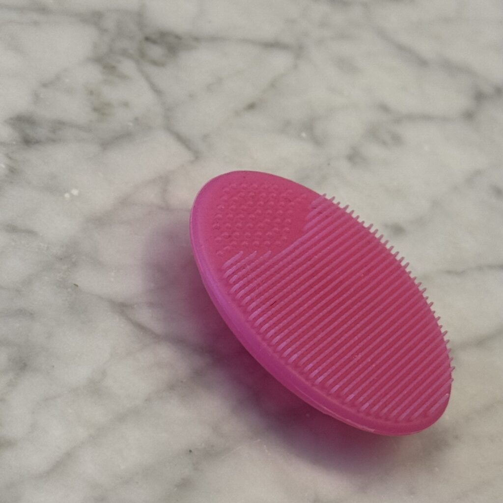Silicone facial cleansing scrubber exfoliator — antimicrobial travel skincare tool for gentle daily exfoliation and pore cleansing.