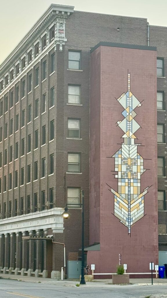 Geometric Prairie School–inspired mural on a brick downtown building in Mason City, Iowa.