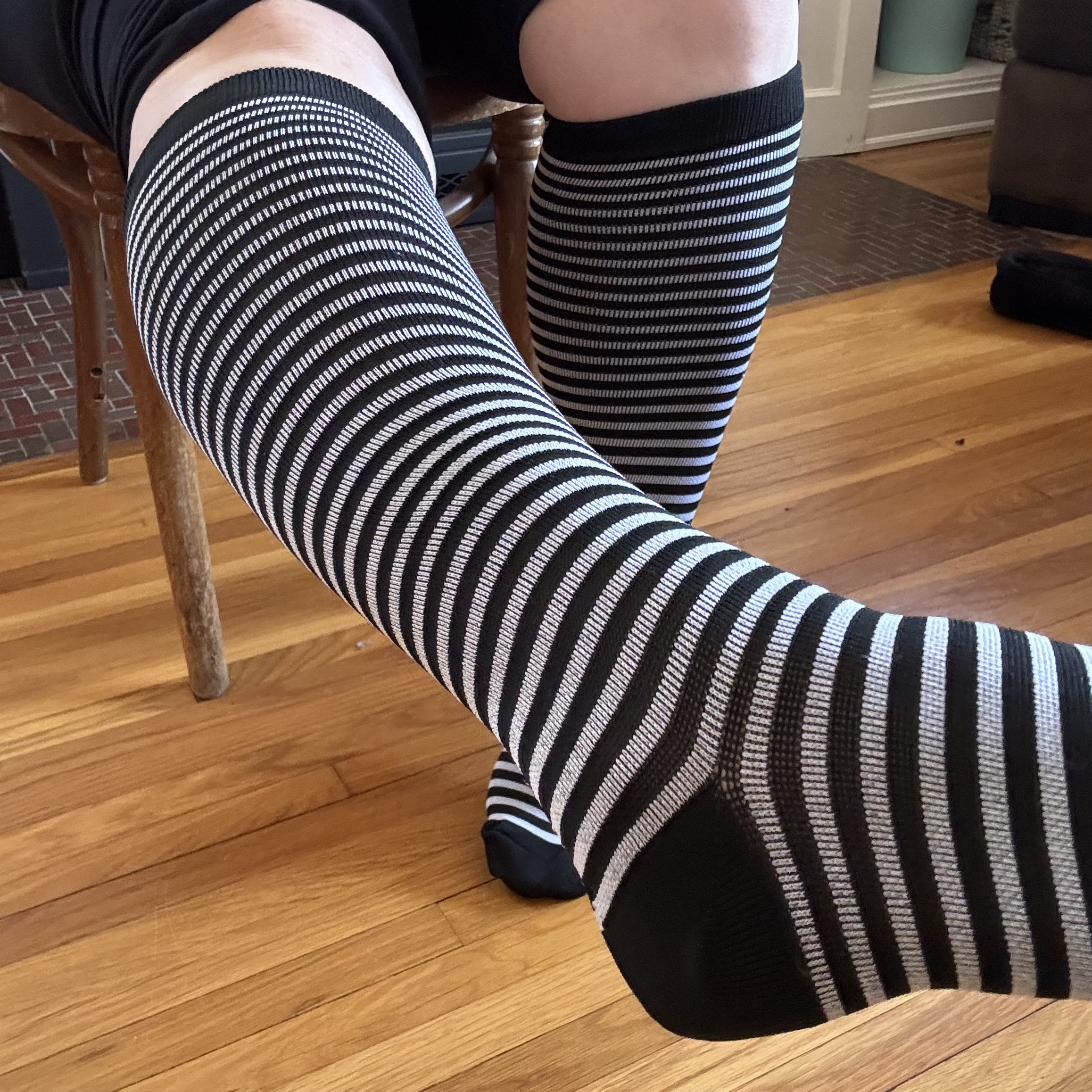 g black-and-white striped compression socks, very wicked witch of the west style.