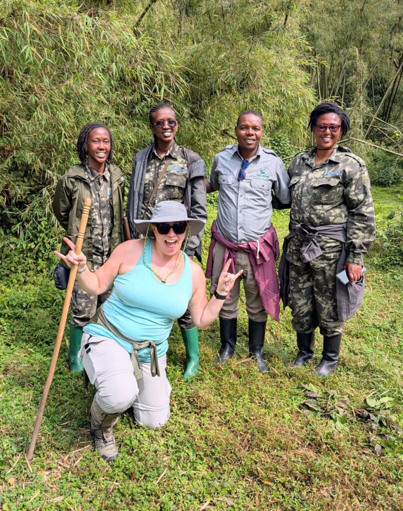 Ginny poses with the badass women guides and trackers of Volcanoes National Park in Rwanda.