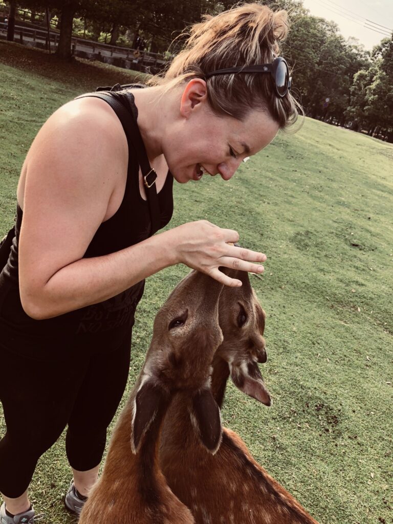 Ginny hand feeds the friendly deer in Nara Park in Japan.