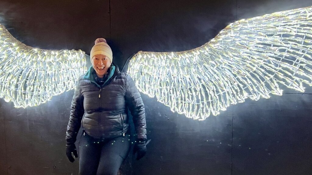 Ginny poses with glowing angle wings.